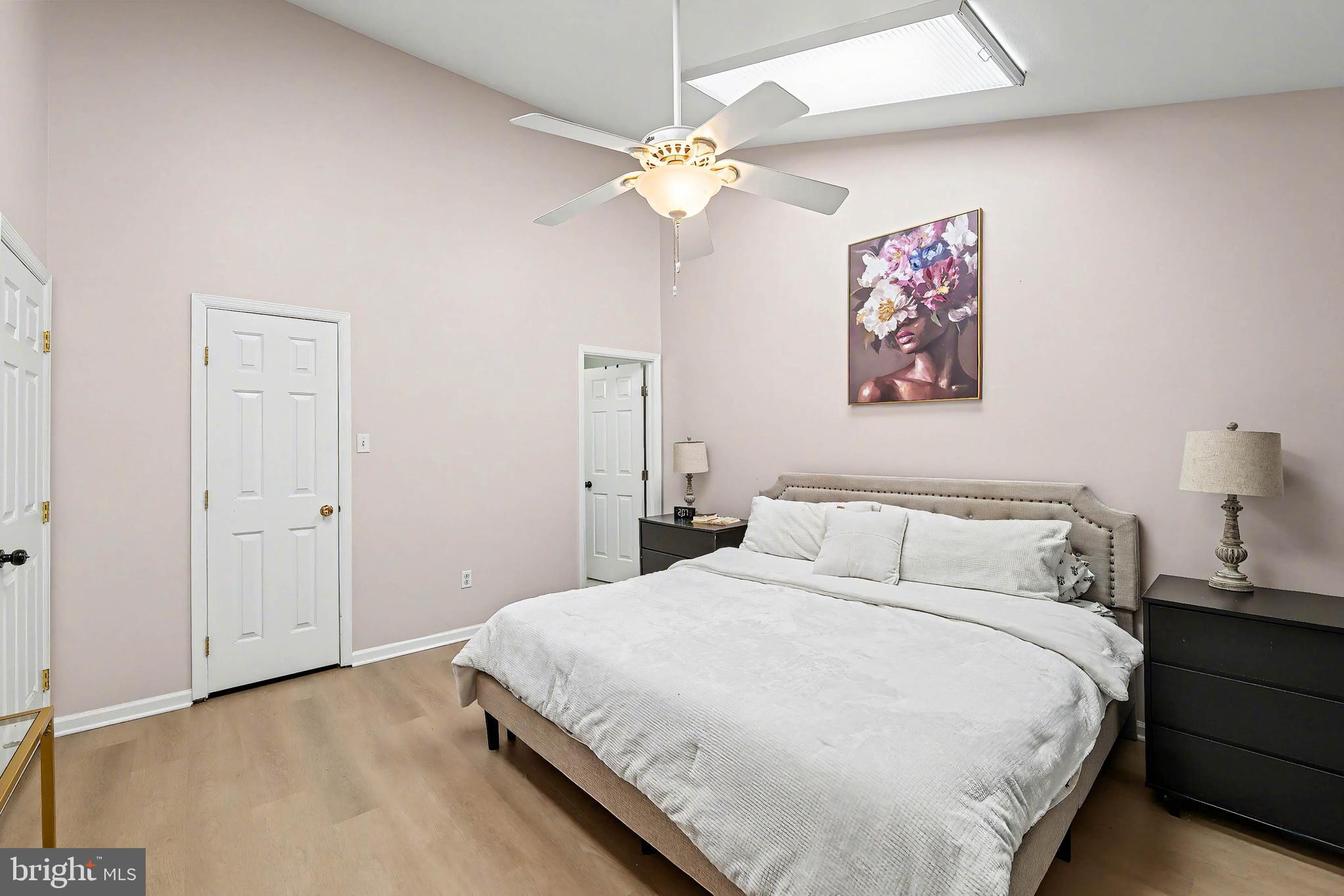 775 Quail Place Deptford, NJ 08096 - Photo 13 of 17 a bedroom with a bed and a chandelier
