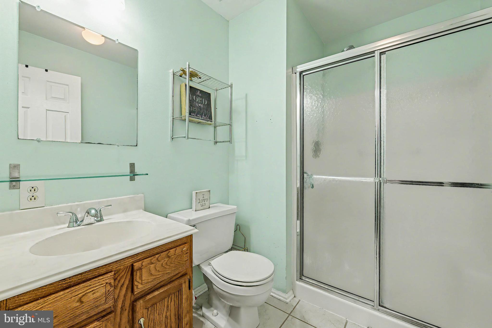775 Quail Place Deptford, NJ 08096 - Photo 14 of 17 a bathroom with a sink toilet and shower