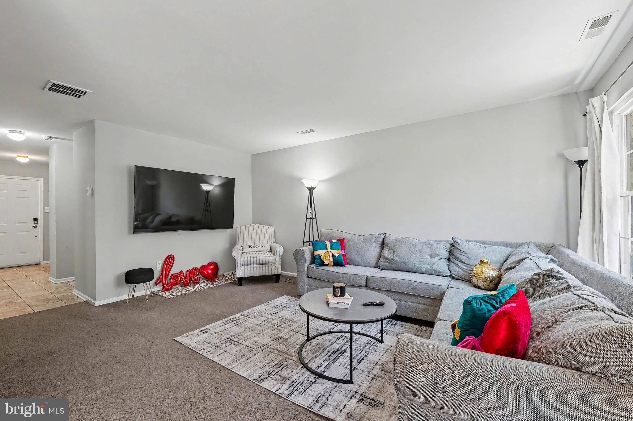 775 Quail Place Deptford, NJ 08096 - Photo 4 of 17 a living room with furniture and a flat screen tv