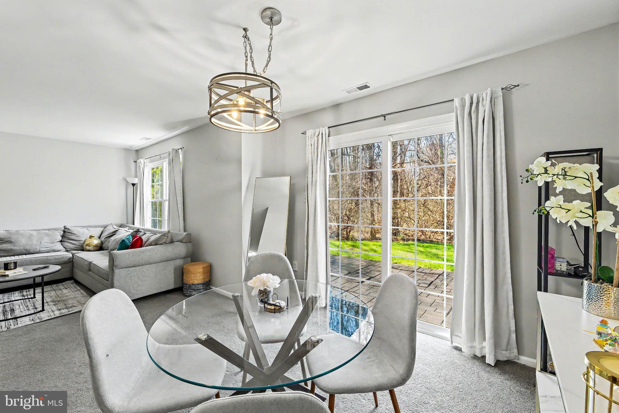 775 Quail Place Deptford, NJ 08096 - Photo 5 of 17 a dining room with furniture a chandelier and wooden floor