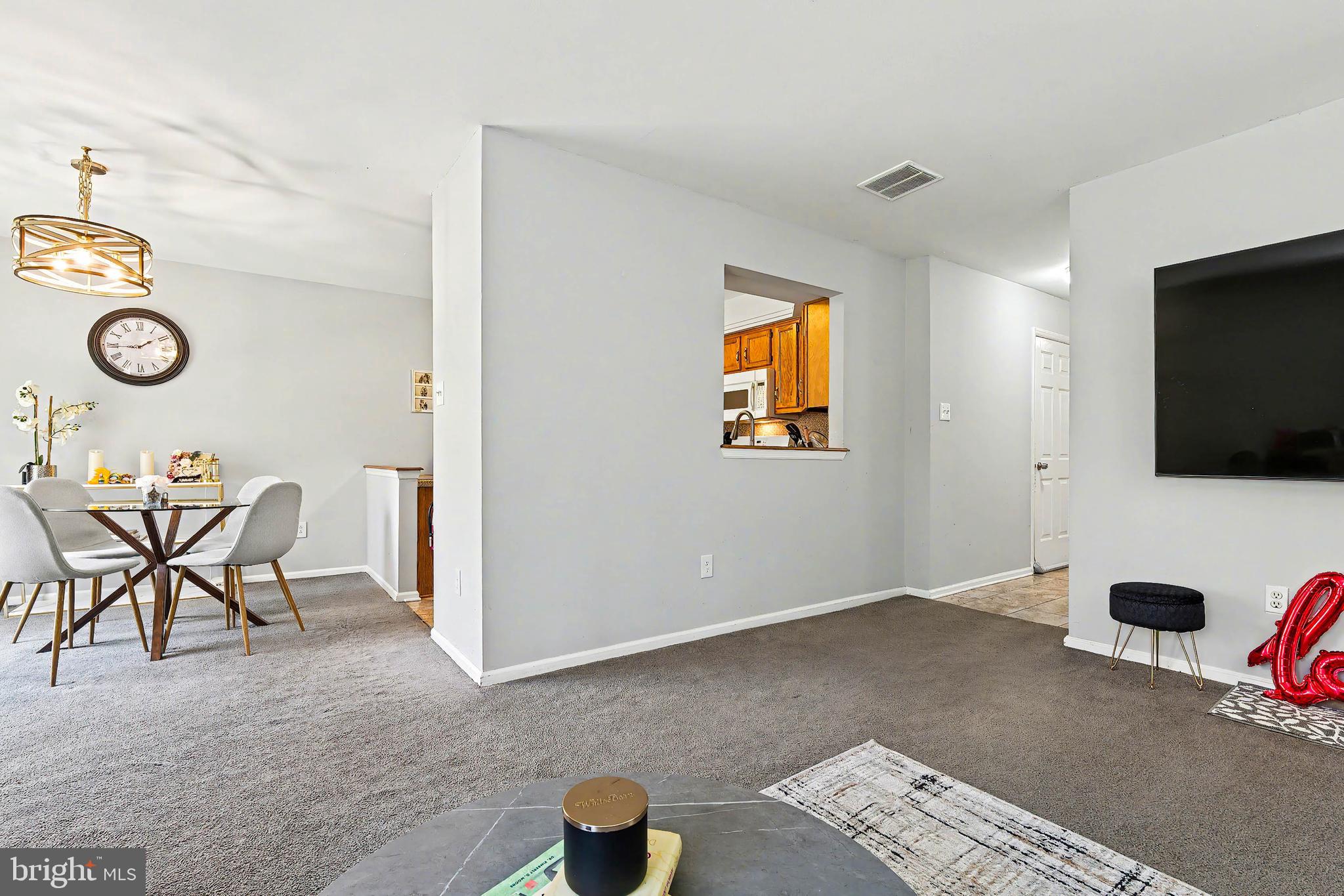 775 Quail Place Deptford, NJ 08096 - Photo 6 of 17 a view of a livingroom with furniture and a flat screen tv