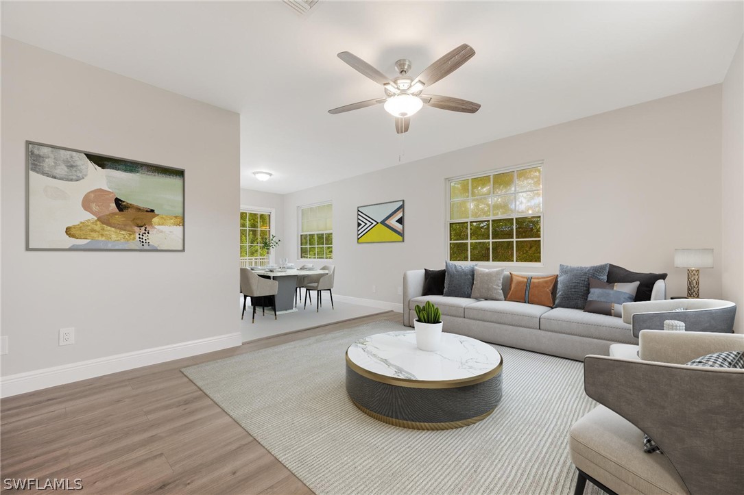 18804 Matanzas Road Fort Myers, FL 33967 - Photo 11 of 19 a living room with fireplace and a table