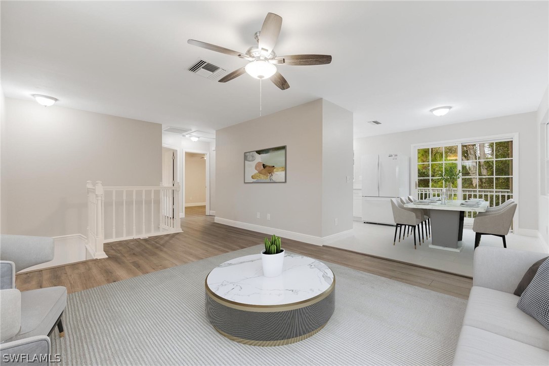 18804 Matanzas Road Fort Myers, FL 33967 - Photo 12 of 19 a living room with furniture and a large window