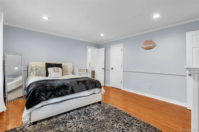 a bedroom with a bed and a table