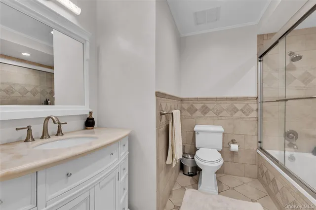 a view of a patio with table and chairs with wooden floor and fence