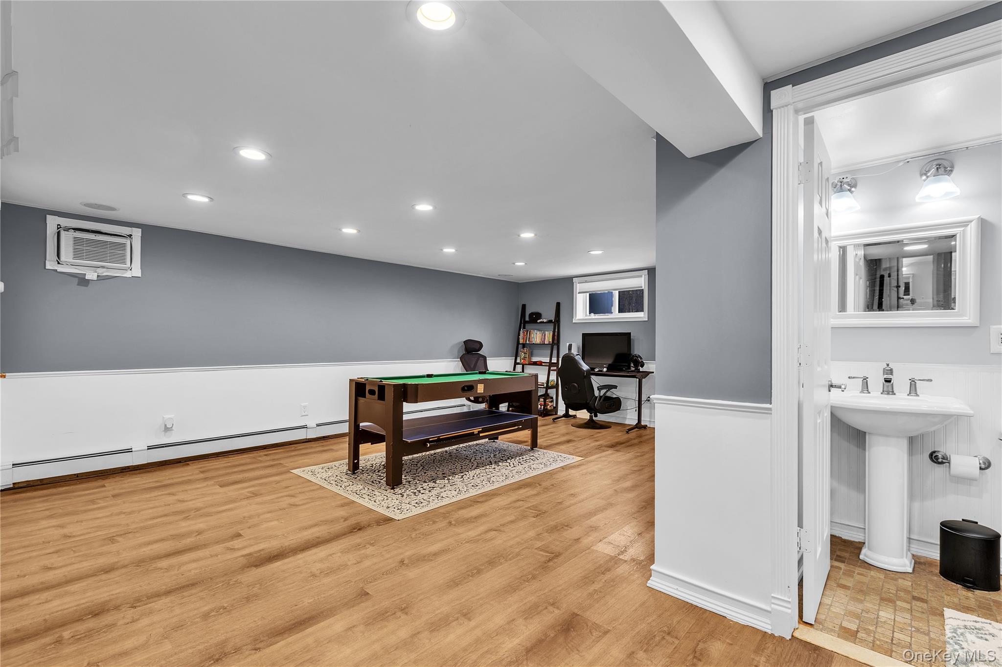 297 Church Road Putnam Valley, NY 10579 - Photo 25 of 42 Recreation room with a desk, recessed lighting, light wood finished floors, and a baseboard heating unit