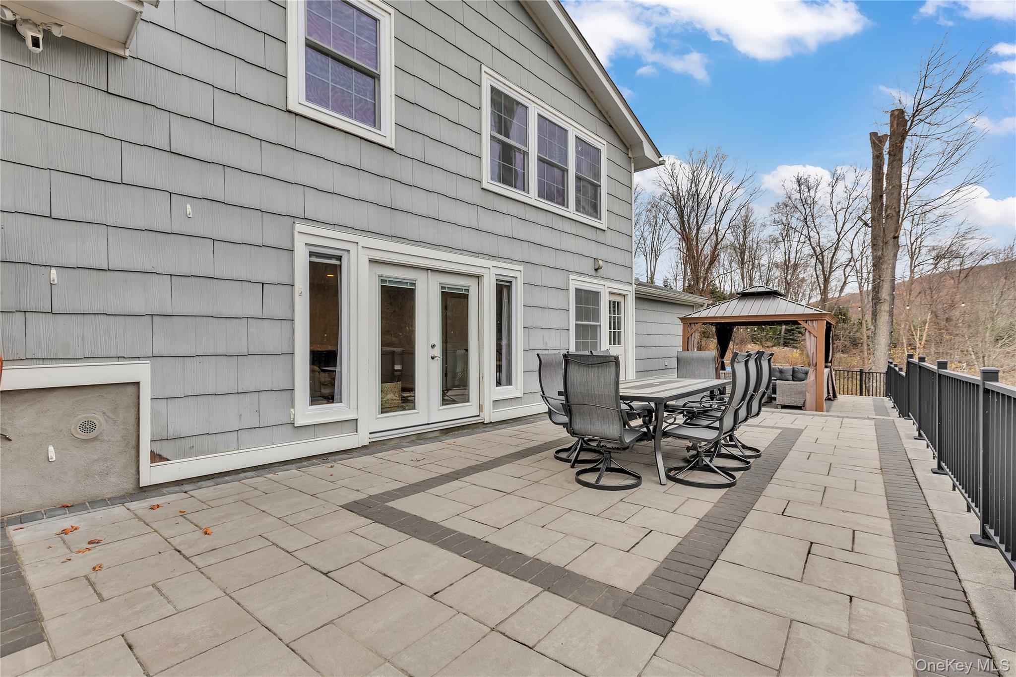 297 Church Road Putnam Valley, NY 10579 - Photo 32 of 42 a view of a patio with table and chairs with wooden floor and fence