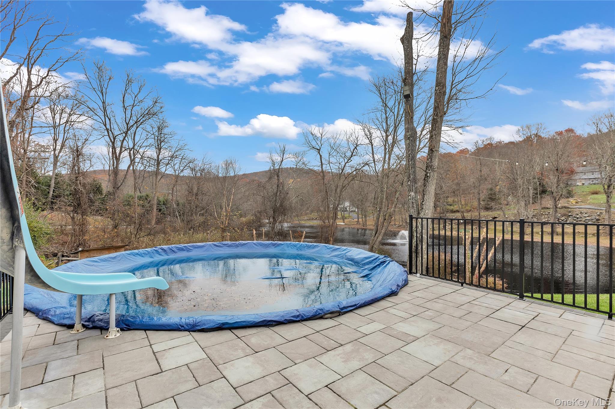 297 Church Road Putnam Valley, NY 10579 - Photo 34 of 42 View of swimming pool with a mountain view, a patio, and a water slide