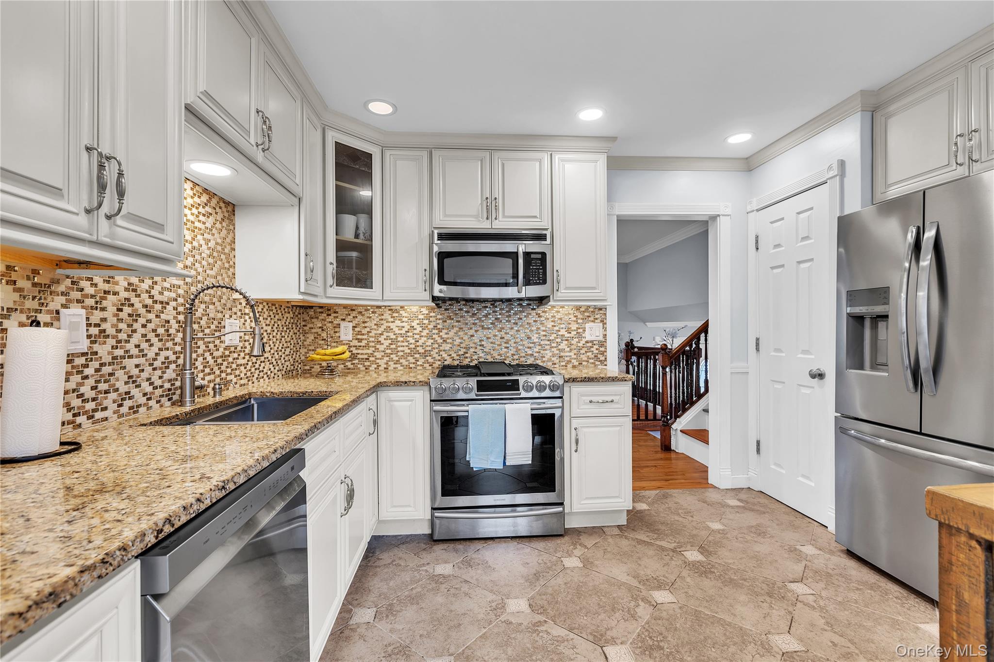 297 Church Road Putnam Valley, NY 10579 - Photo 8 of 42 a kitchen with stainless steel appliances granite countertop a stove a sink and a refrigerator