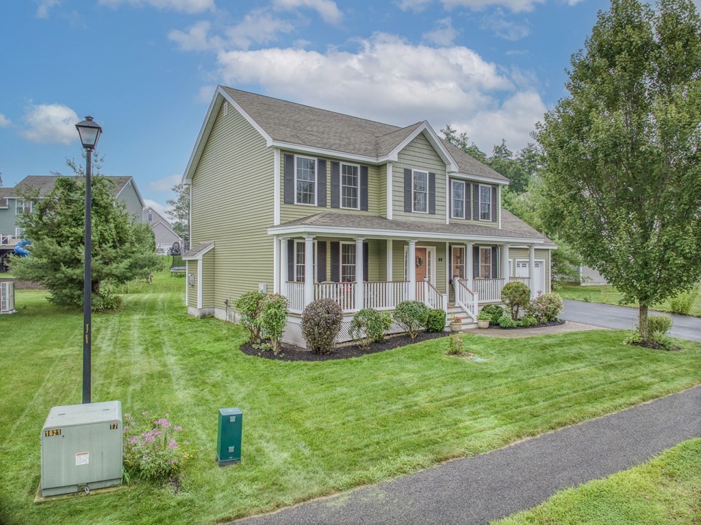68 Diamondback Avenue Nashua, NH 03062 - Photo 1 of 22 a front view of a house with a yard