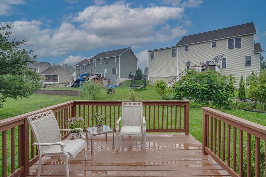 68 Diamondback Avenue Nashua, NH 03062 - Photo 20 of 22 a view of a chair and table in the balcony