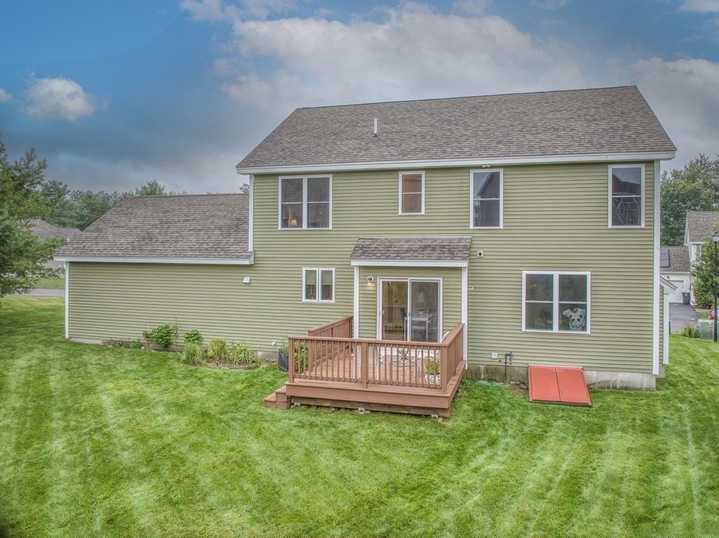 68 Diamondback Avenue Nashua, NH 03062 - Photo 22 of 22 a front view of a house with a yard and trees