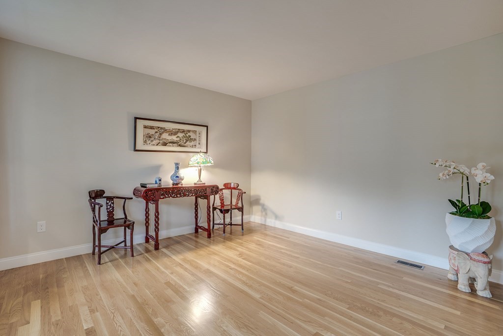 68 Diamondback Avenue Nashua, NH 03062 - Photo 9 of 22 a view of a dining room with furniture and wooden floor