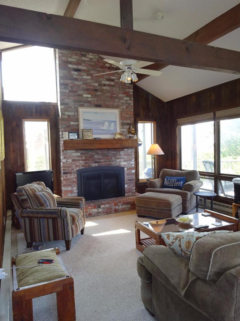51 9th Street Wellfleet, MA 02667 - Photo 11 of 35 a living room with furniture and a fireplace