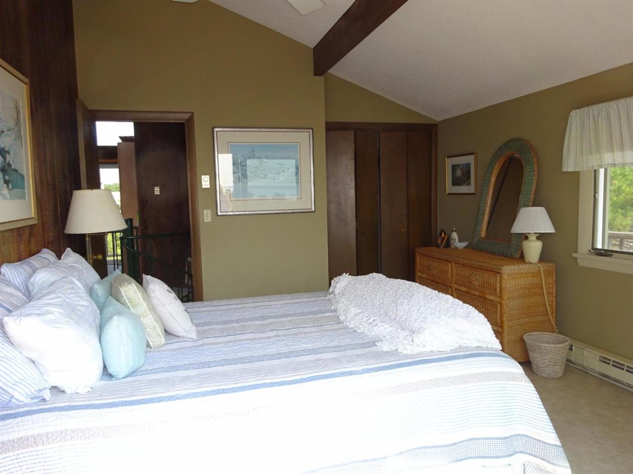 51 9th Street Wellfleet, MA 02667 - Photo 20 of 35 a bedroom with a bed and a mirror
