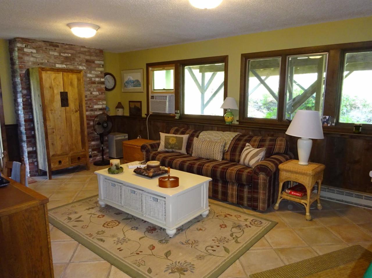 51 9th Street Wellfleet, MA 02667 - Photo 24 of 35 a living room with furniture and a large window