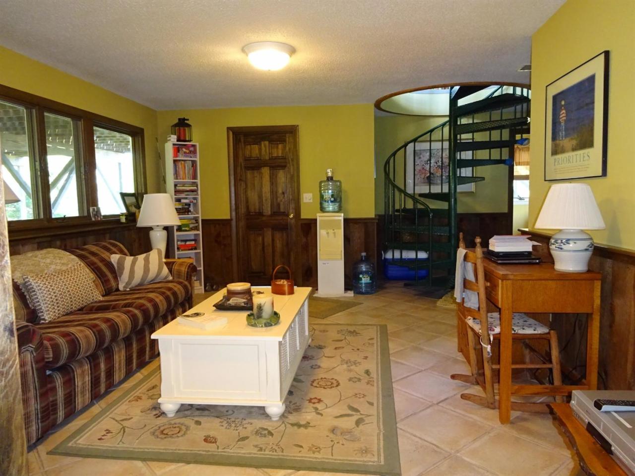 51 9th Street Wellfleet, MA 02667 - Photo 26 of 35 a living room with furniture a window and kitchen view
