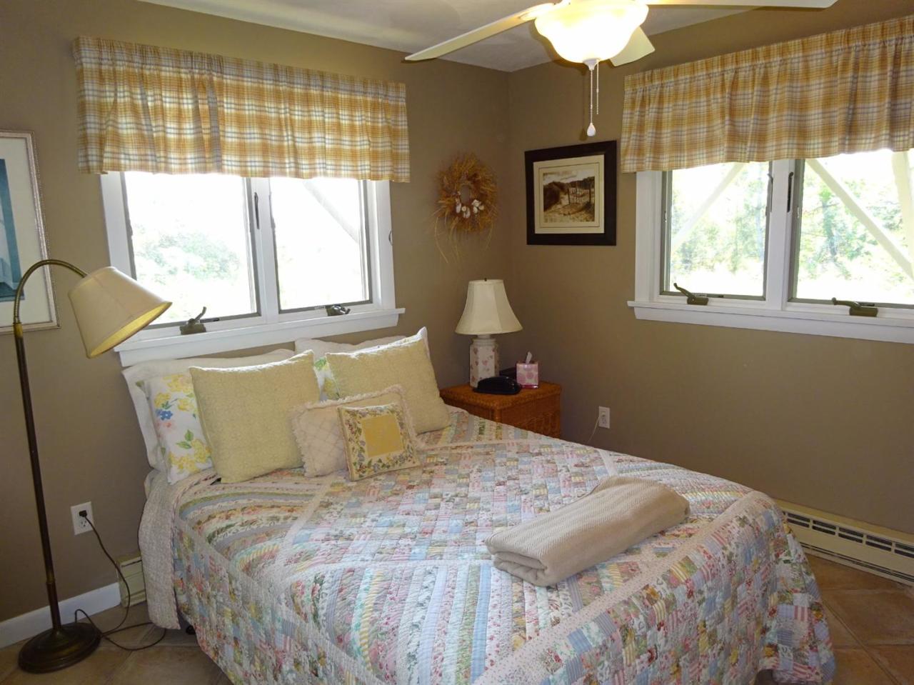 51 9th Street Wellfleet, MA 02667 - Photo 28 of 35 a bedroom with a bed and windows