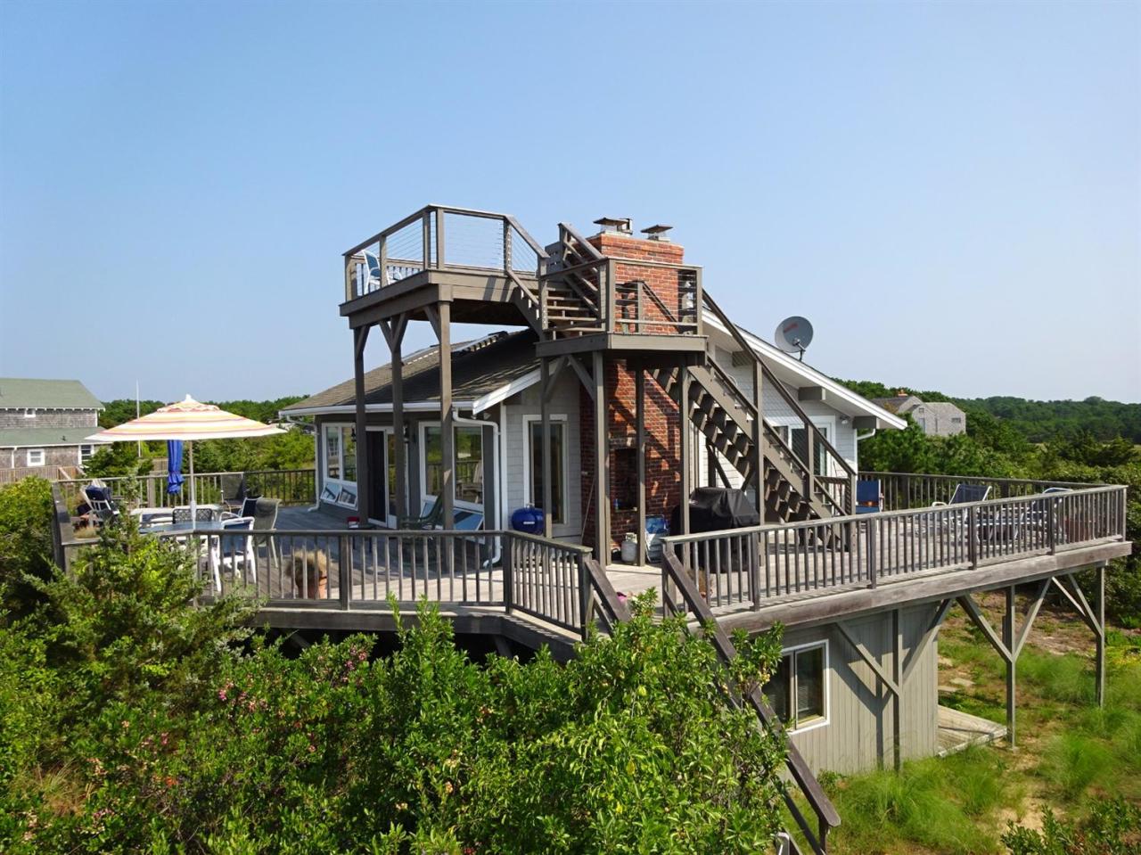 51 9th Street Wellfleet, MA 02667 - Photo 5 of 35 a view of a chair and table in the balcony