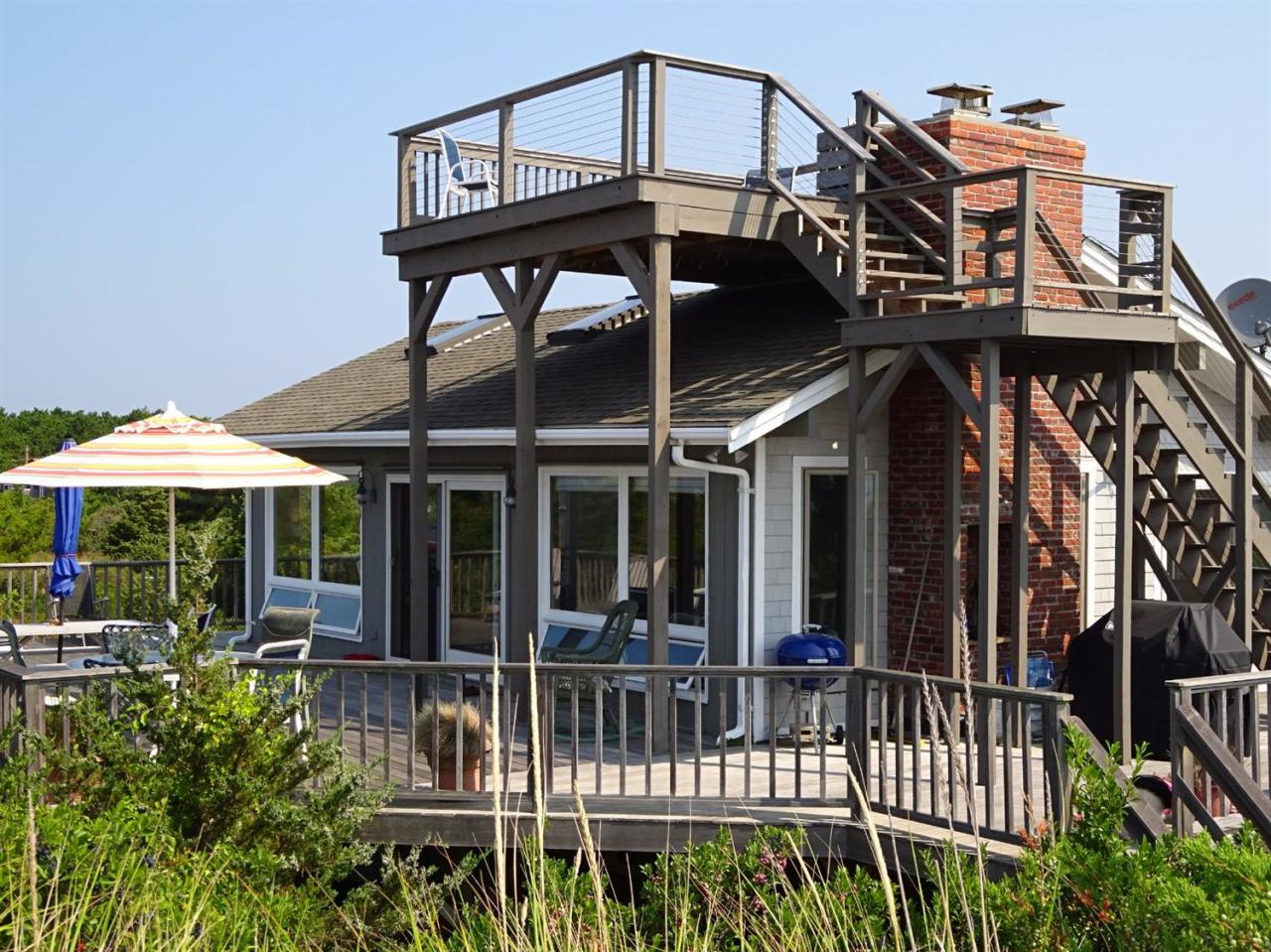 51 9th Street Wellfleet, MA 02667 - Photo 6 of 35 a view of a house with a deck