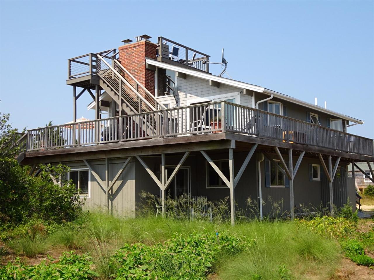 51 9th Street Wellfleet, MA 02667 - Photo 8 of 35 a view of a house with pool and wooden fence