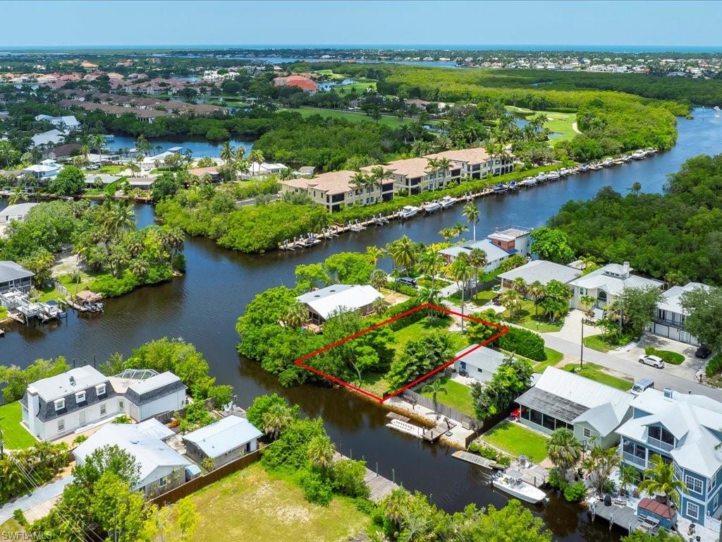 2977 Poplar Street Naples, FL 34112 - Photo 10 of 10 an aerial view of water body with boats and residential houses with outdoor space
