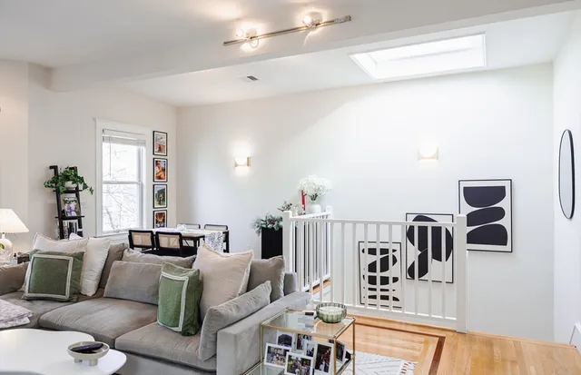 a living room with furniture and a table