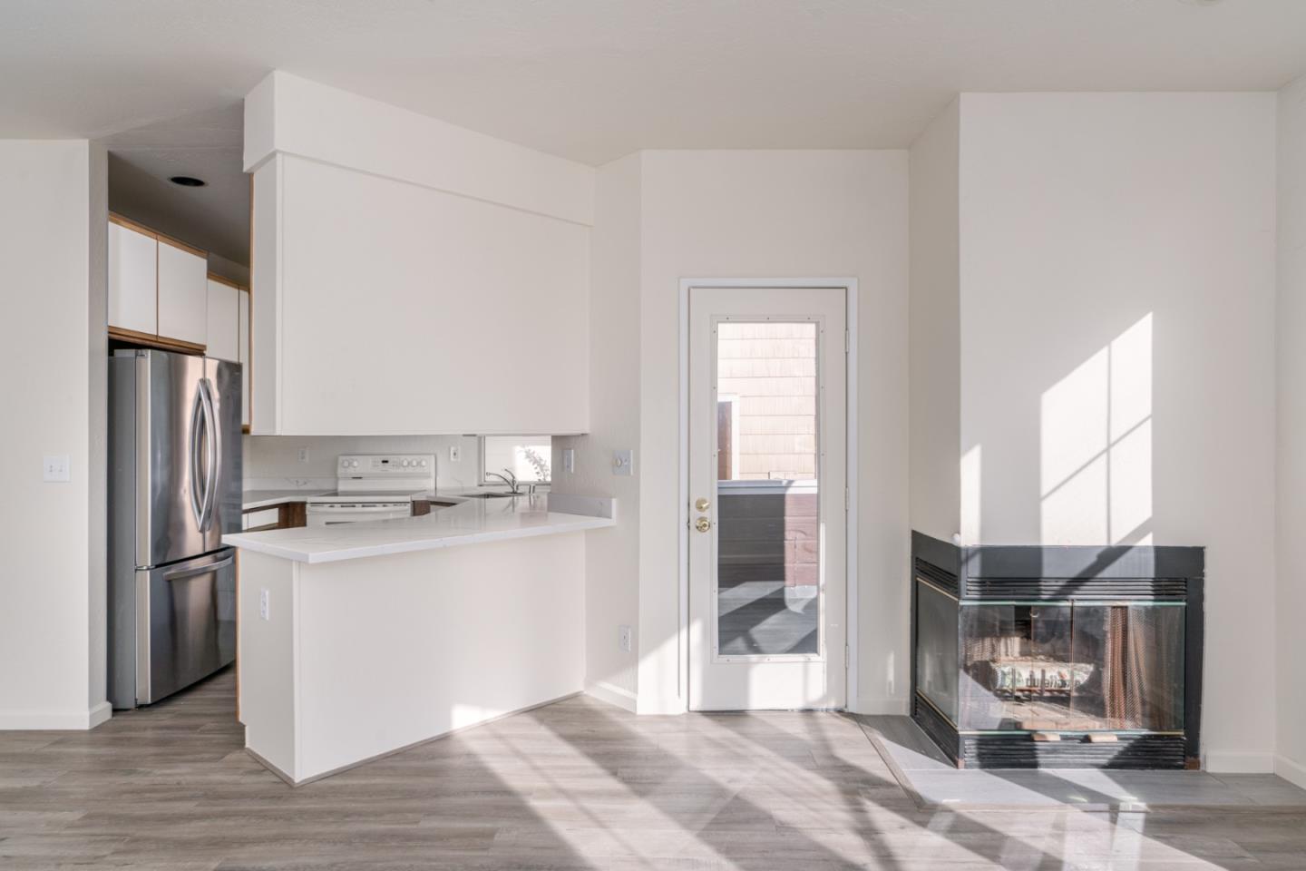 435 Norfolk Drive Pacifica, CA 94044 - Photo 4 of 28 a kitchen with stainless steel appliances a refrigerator and a stove top oven