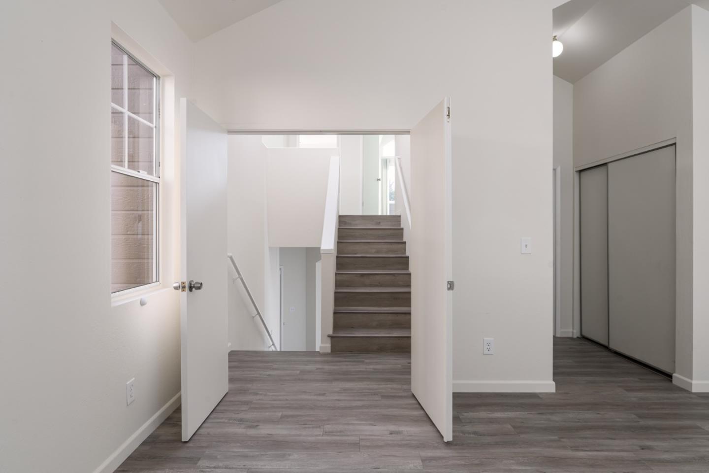 435 Norfolk Drive Pacifica, CA 94044 - Photo 6 of 28 wooden floor in an empty room with a window