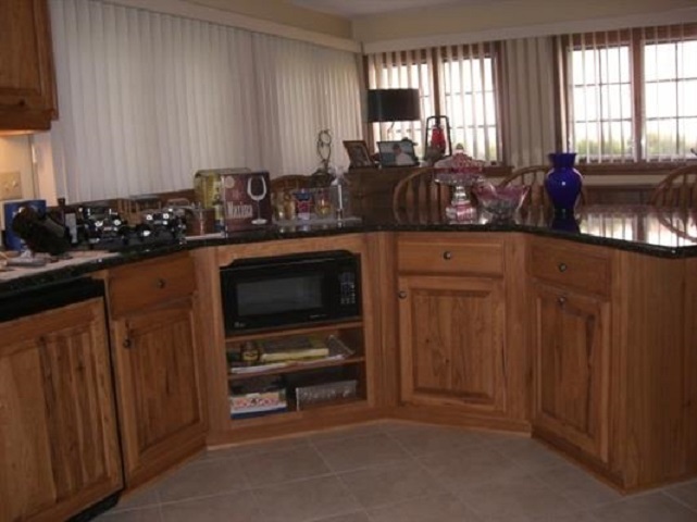 810 Roxbury Road Rockford, IL 61107 - Photo 11 of 13 a kitchen with stainless steel appliances a stove a sink and a microwave