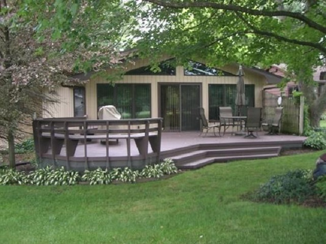 810 Roxbury Road Rockford, IL 61107 - Photo 4 of 13 a view of a house with a yard and sitting area