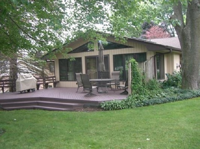 810 Roxbury Road Rockford, IL 61107 - Photo 5 of 13 a front view of house with yard and outdoor seating
