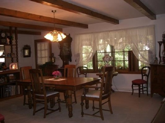 810 Roxbury Road Rockford, IL 61107 - Photo 10 of 13 a view of a dining room with furniture and chandelier