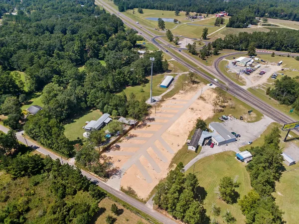 an aerial view of a residential houses with outdoor space