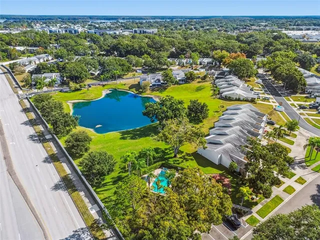an aerial view of residential houses with outdoor space