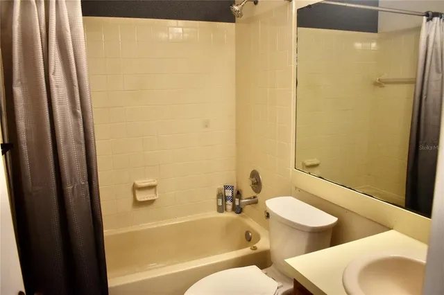 a bathroom with sink and mirror