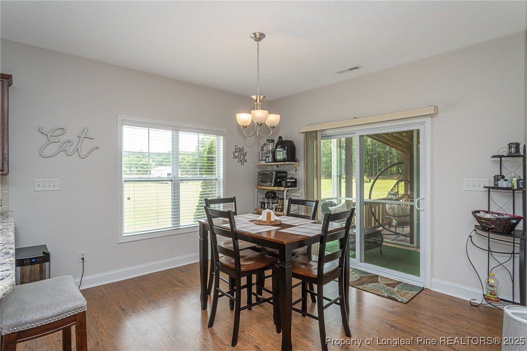 8220 Rivermist Lane Linden, NC 28356 - Photo 14 of 44 a view of a dining room with furniture window and outside view