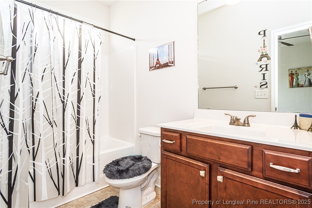 8220 Rivermist Lane Linden, NC 28356 - Photo 18 of 44 a bathroom with a sink and a mirror