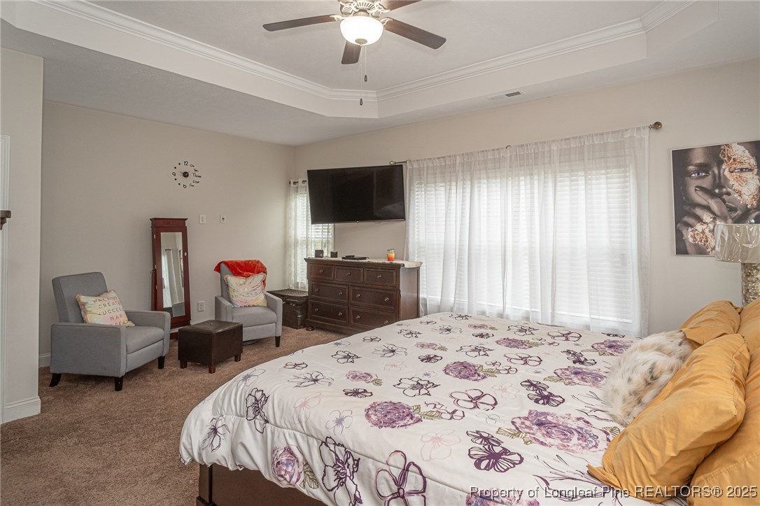 8220 Rivermist Lane Linden, NC 28356 - Photo 22 of 44 a bed room with a bed a television and a couch