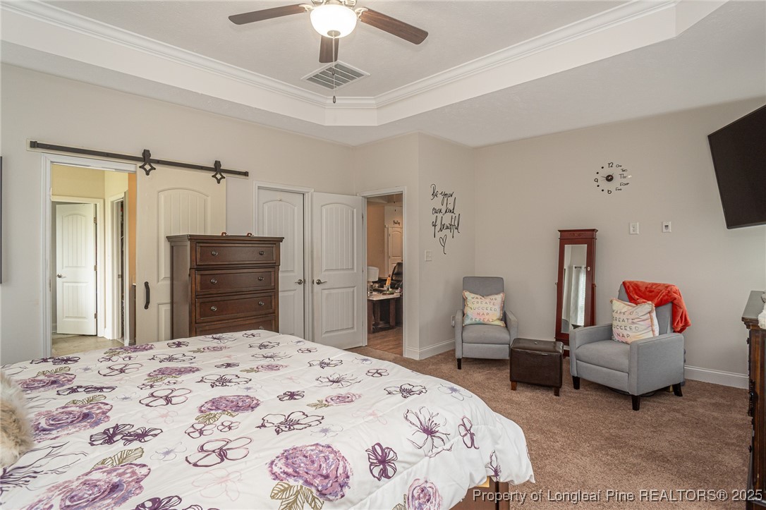 8220 Rivermist Lane Linden, NC 28356 - Photo 23 of 44 a bedroom with a bed and a couch