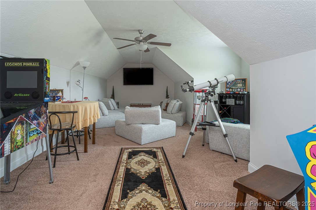 8220 Rivermist Lane Linden, NC 28356 - Photo 31 of 44 a living room with furniture and a flat screen tv