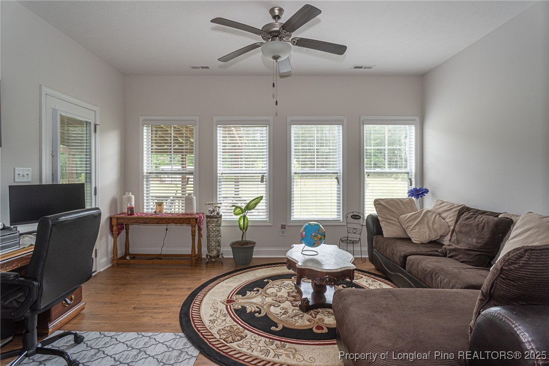 8220 Rivermist Lane Linden, NC 28356 - Photo 32 of 44 a living room with furniture and a large window