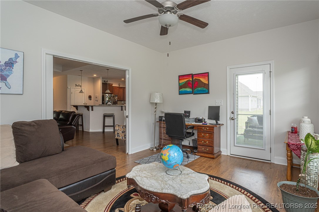 8220 Rivermist Lane Linden, NC 28356 - Photo 33 of 44 a living room with furniture and wooden floor