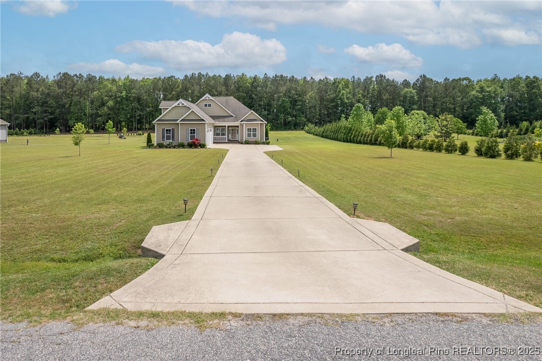 8220 Rivermist Lane Linden, NC 28356 - Photo 34 of 44 a view of balcony with yard and ocean view