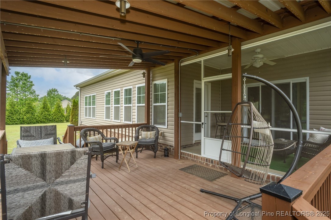 8220 Rivermist Lane Linden, NC 28356 - Photo 37 of 44 a patio with glass top table and chairs