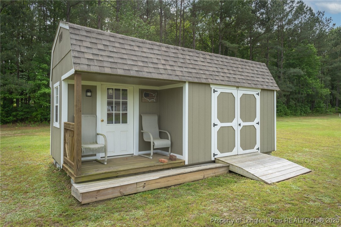8220 Rivermist Lane Linden, NC 28356 - Photo 40 of 44 a front view of a house with a garden