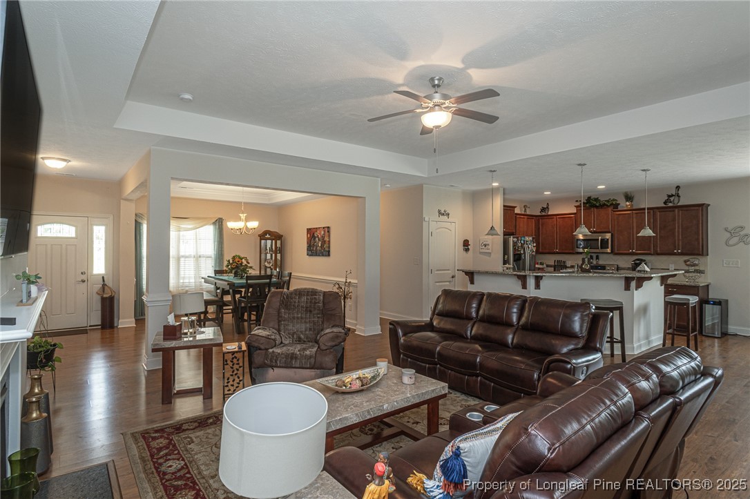 8220 Rivermist Lane Linden, NC 28356 - Photo 6 of 44 a living room with furniture and a view of kitchen
