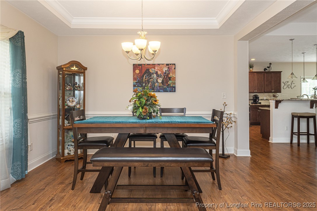 8220 Rivermist Lane Linden, NC 28356 - Photo 8 of 44 a view of a dining room with furniture and wooden floor