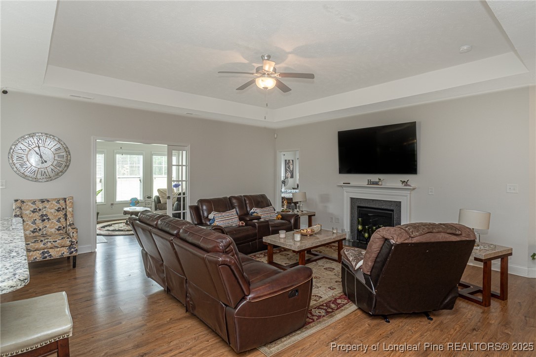 8220 Rivermist Lane Linden, NC 28356 - Photo 9 of 44 a living room with furniture and a flat screen tv