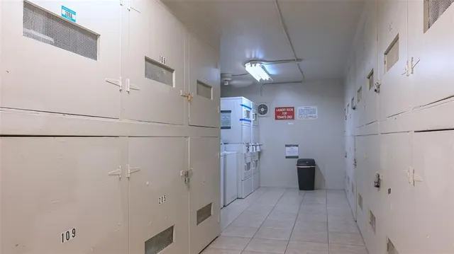 a view of a storage & utility room with racks on the wall